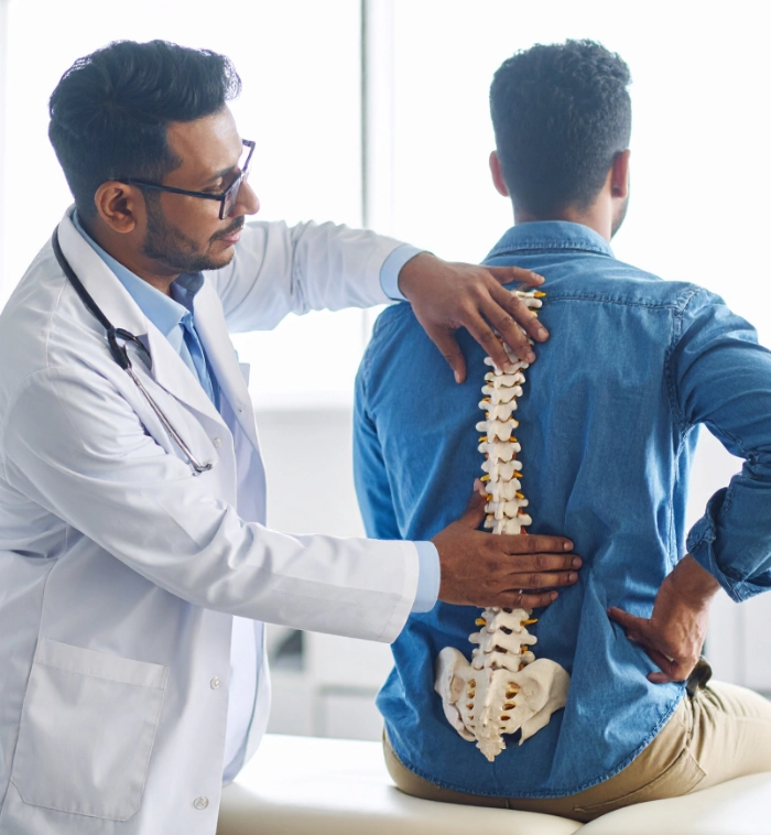 doctor placing education spine on patients back