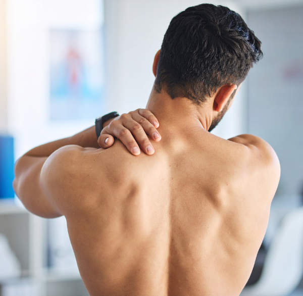 man with upper spinal and neck pain