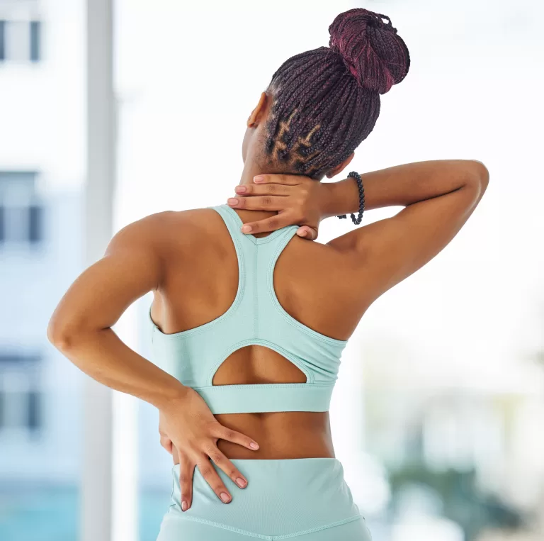 black woman with back and neck pain